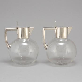 A pair of caraffes with silver mountings by CG Hallberg, Stockholm 1890.