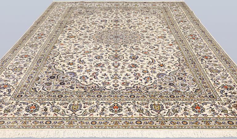 A Keshan carpet, signed, c. 395 x 295 cm.