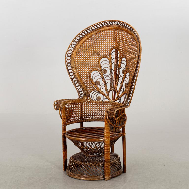 A RATTAN ARMCHAIR.