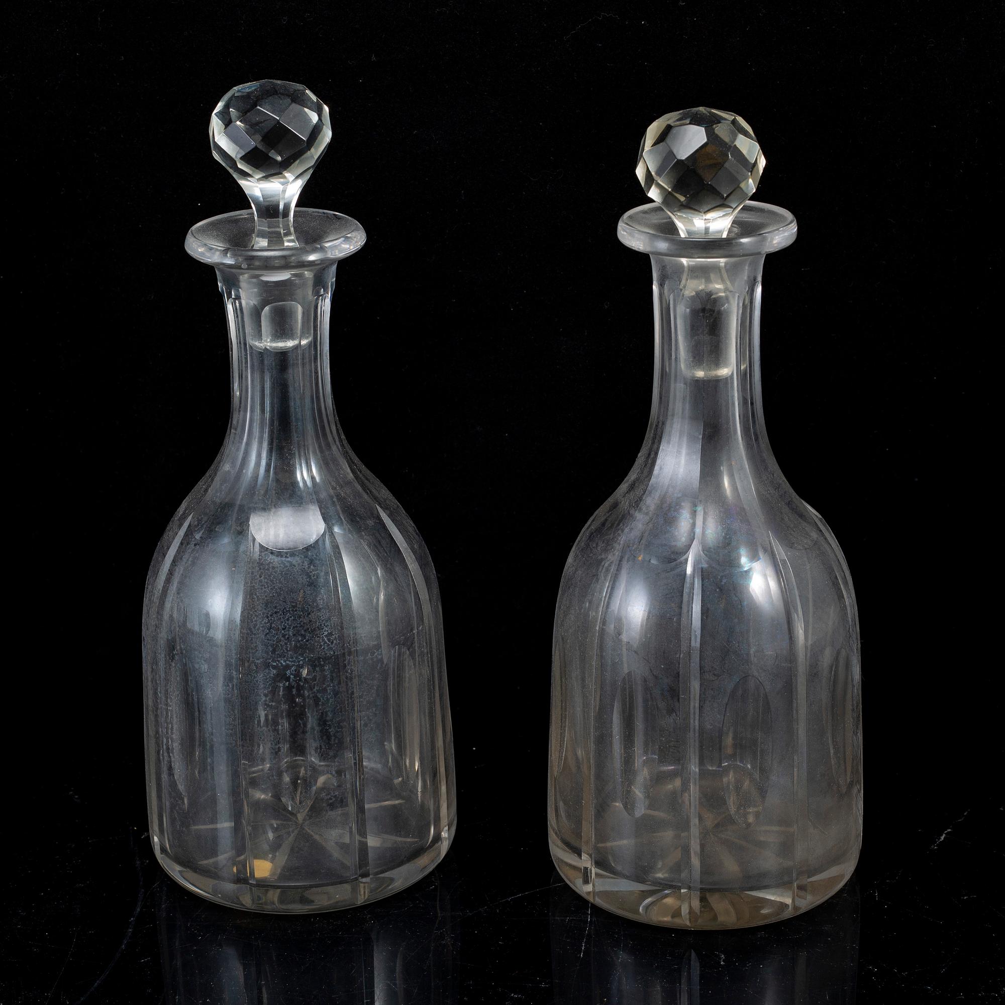 A set of four bottles with stoppers, 20th Century.