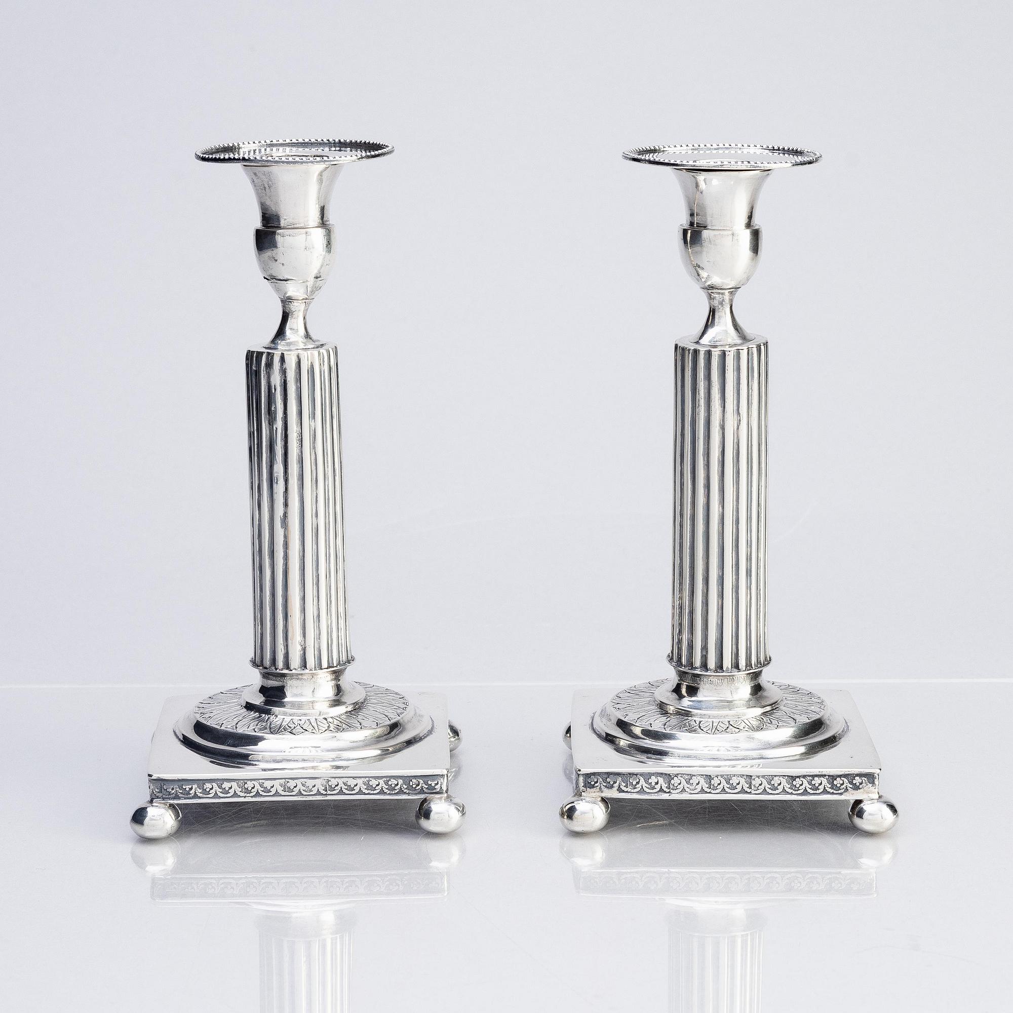 A pair of Gustavian silver candlesticks, unclear maker's mark, the cuffs with mark of Pehr Zethelius, Stockholm 1796.