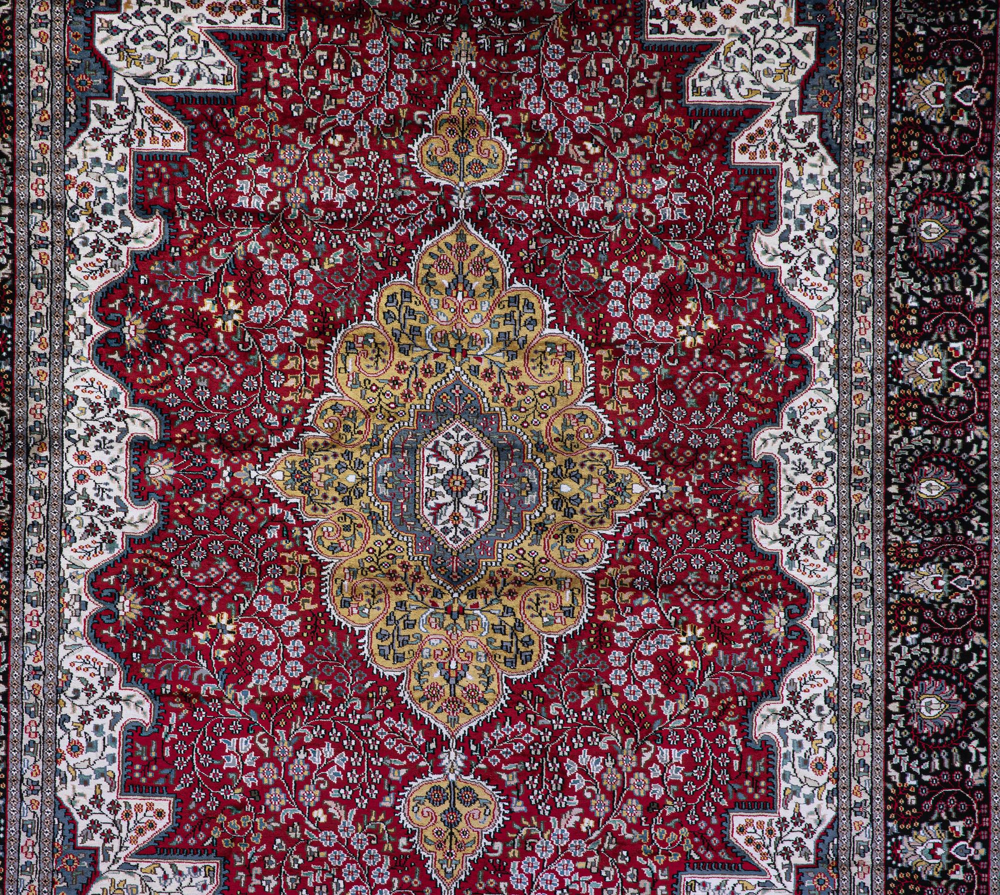 A carpet, Oriental Silk, ca 337 x 241 cm.