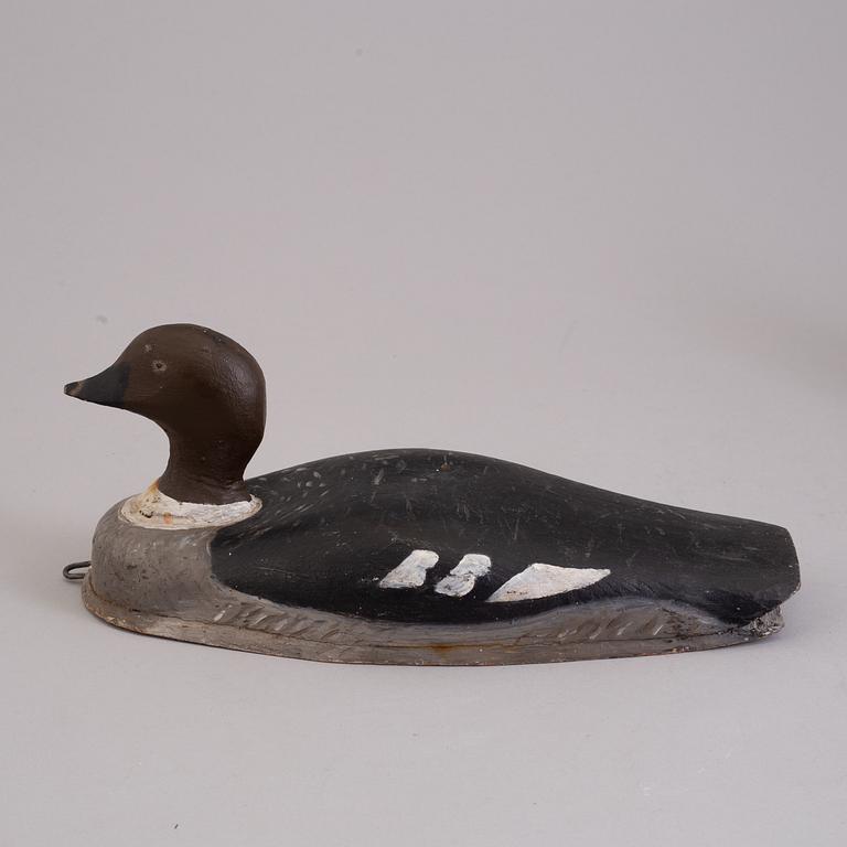 4 painted wooden ducks from the 20th century.