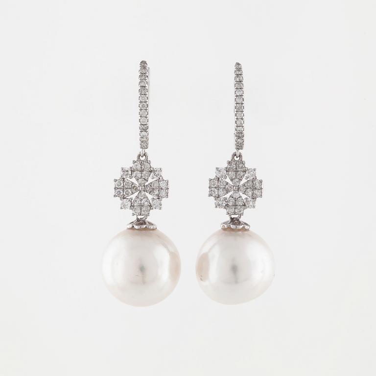 A pair of cultured pearl and brilliant cut diamond earrings.