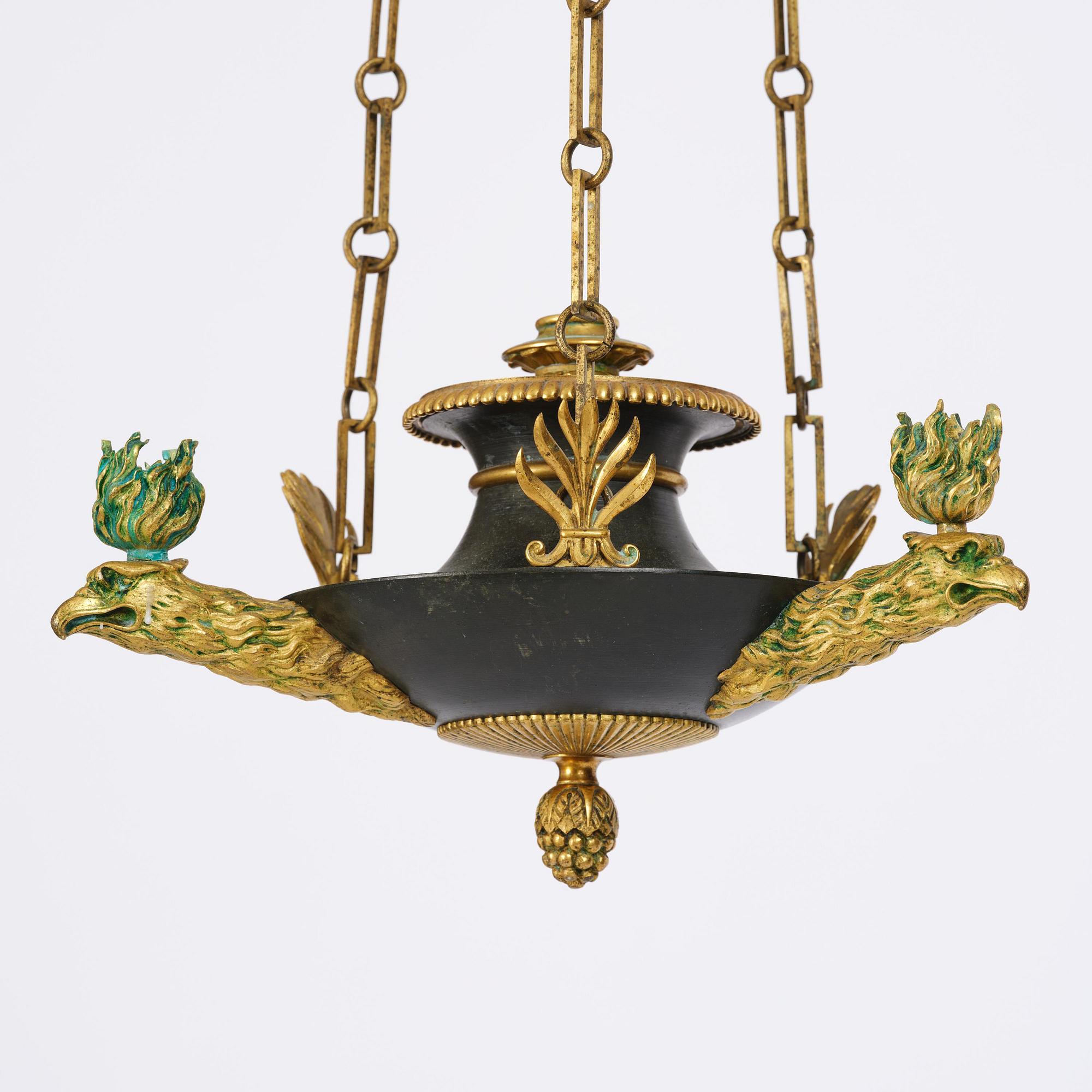 An Empire ormolu and patinated bronze four-light chandelier, Stockholm, early 19th century.
