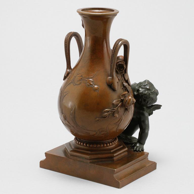 A patinated bronze vase after Auguste Moreau, made around year 1900.