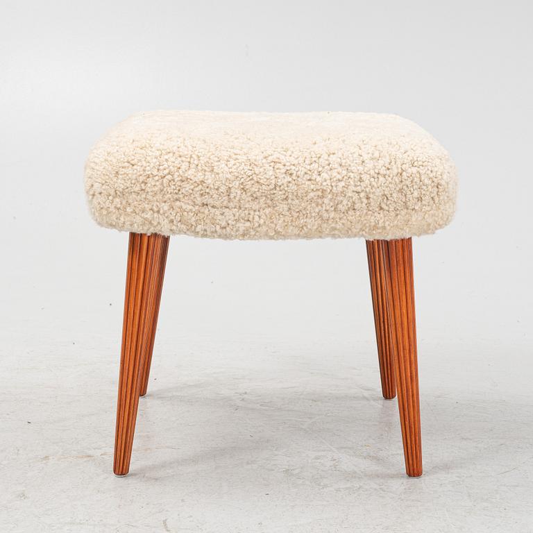 A Swedish modern shearling stool from the mid 20th century.