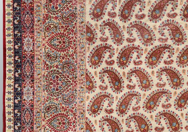 A Kirman carpet, signed, c. 390 x 295 cm.