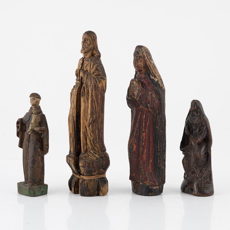 Four wooden sculptures, 18th century or older.