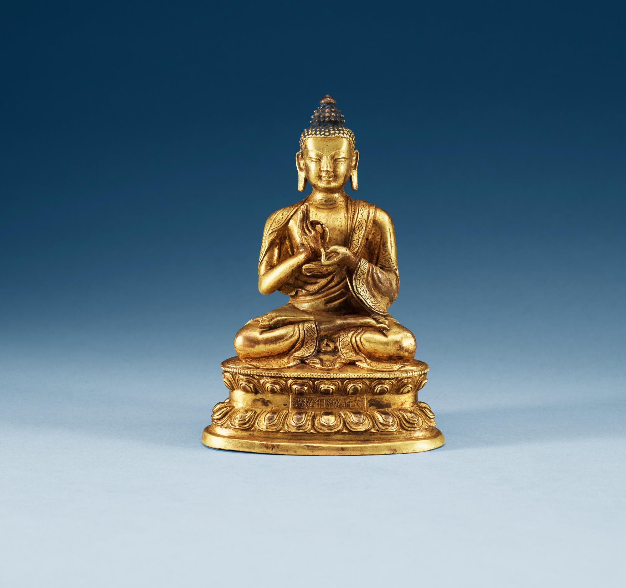 A gilt copper Buddha, presumably Qing dynasty, with Qian Long seven character mark.