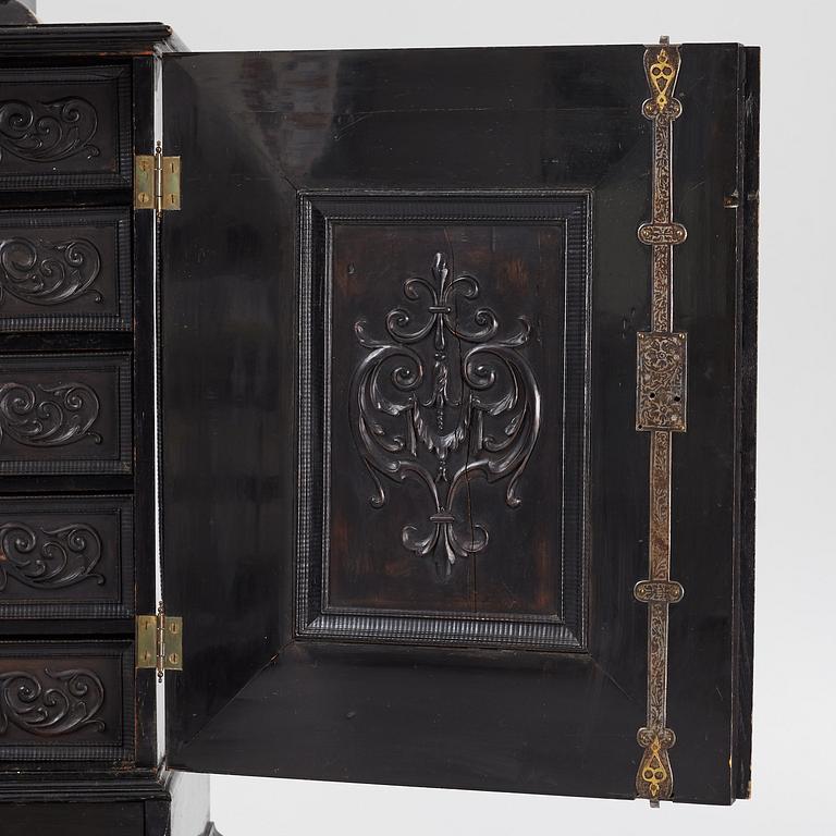 A South-German Baroque ebonized collector's cabinet on stand, circa 1700.