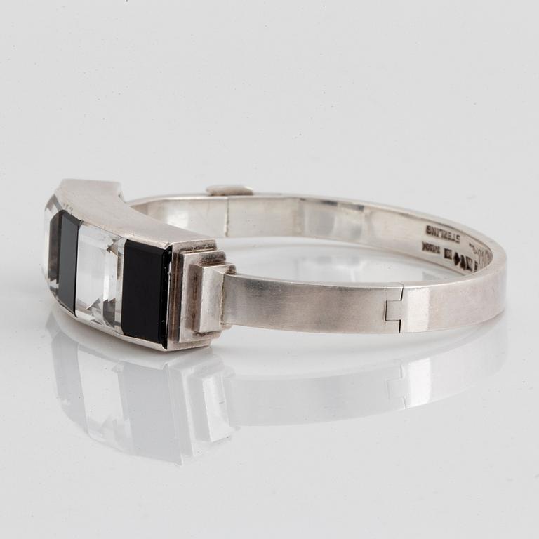 Wiwen Nilsson, a sterling silver bangle with facet cut rock crystal and onyx, Lund, Sweden 1940.