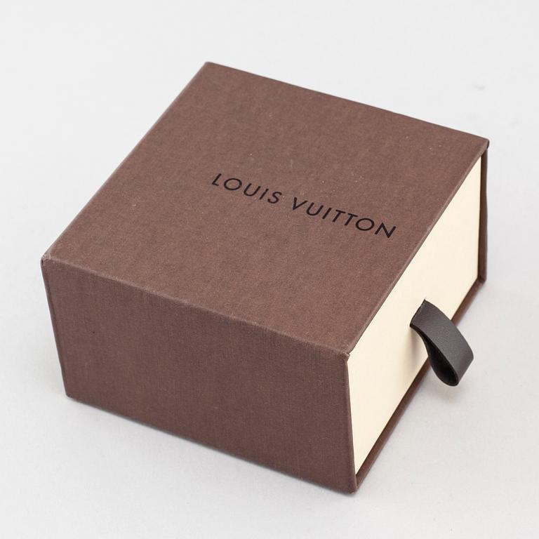 A bracelet by Louis Vuitton.