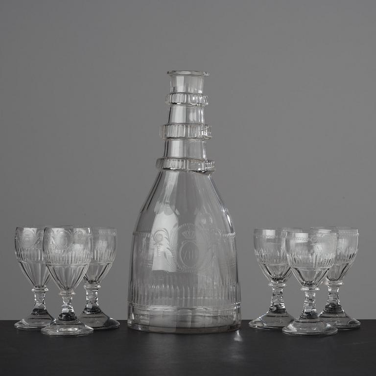 A large bottle and six glasses, Sweden, Reijmyre glassworks, circa 1810. Engraved by Anders Spolander.