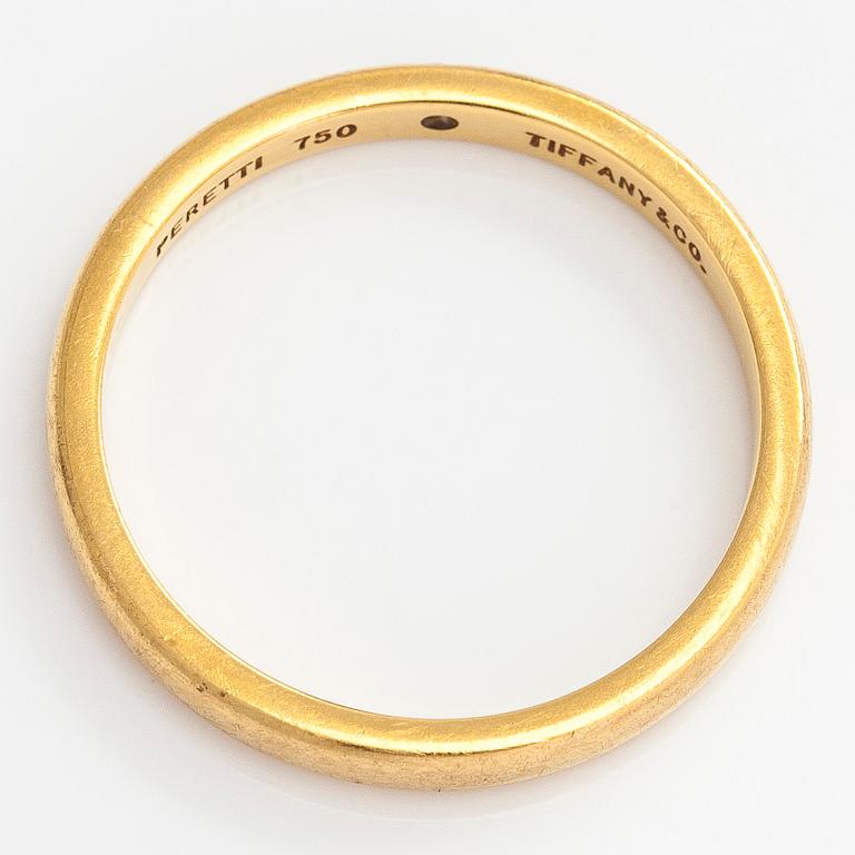 Tiffany & Co, Elsa Peretti, an 18K gold ring, with a small diamond.