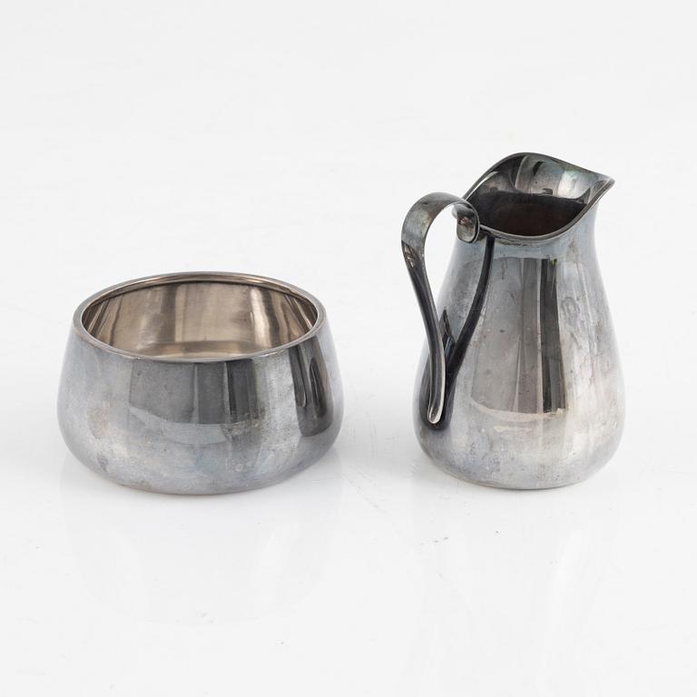 A sterling silver cream-jug and a suger bow, mark of Åke Strömdahl, Stockholm 1961.