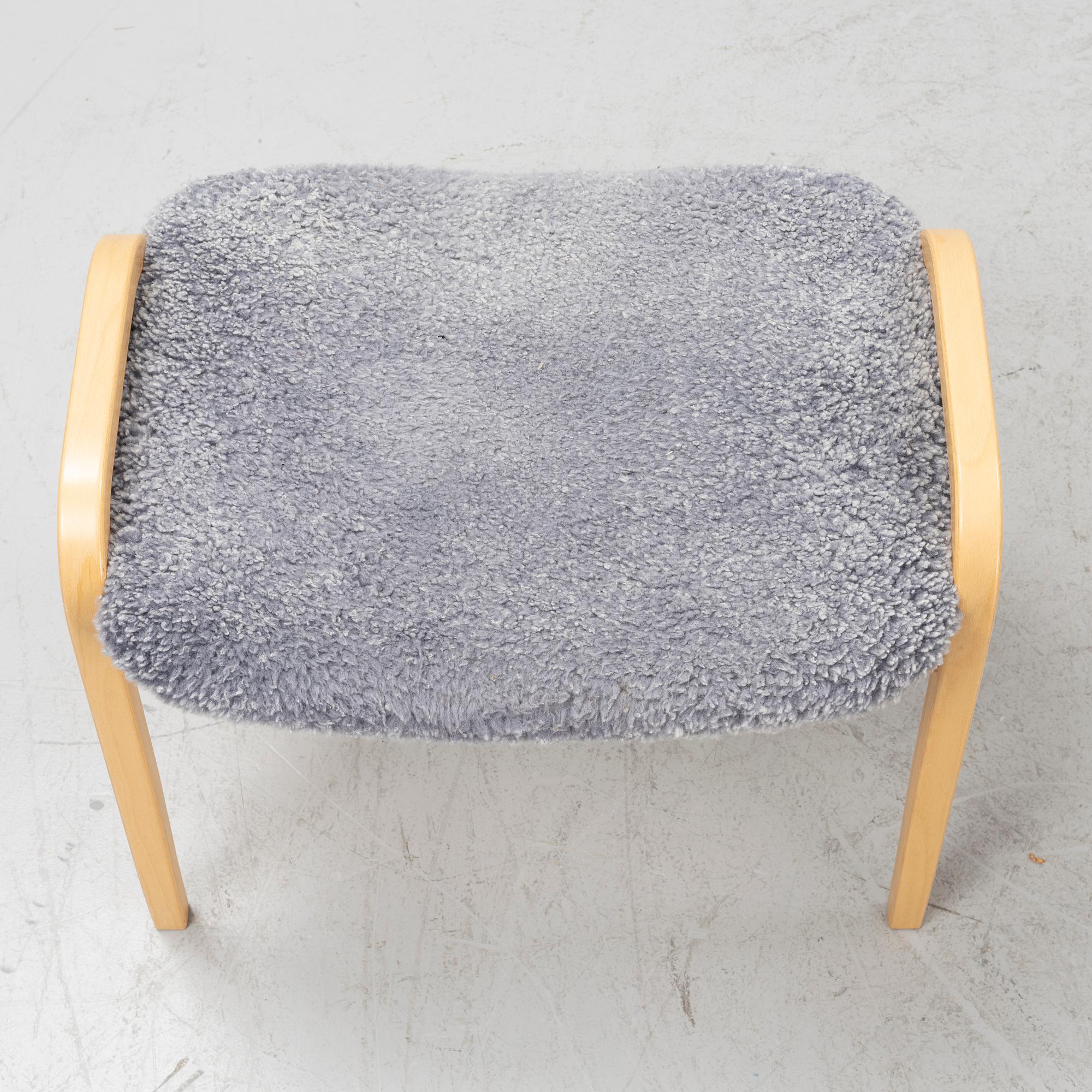 Yngve Ekström, A 'Lamino' easy chair with stool, Swedese, dated -07.