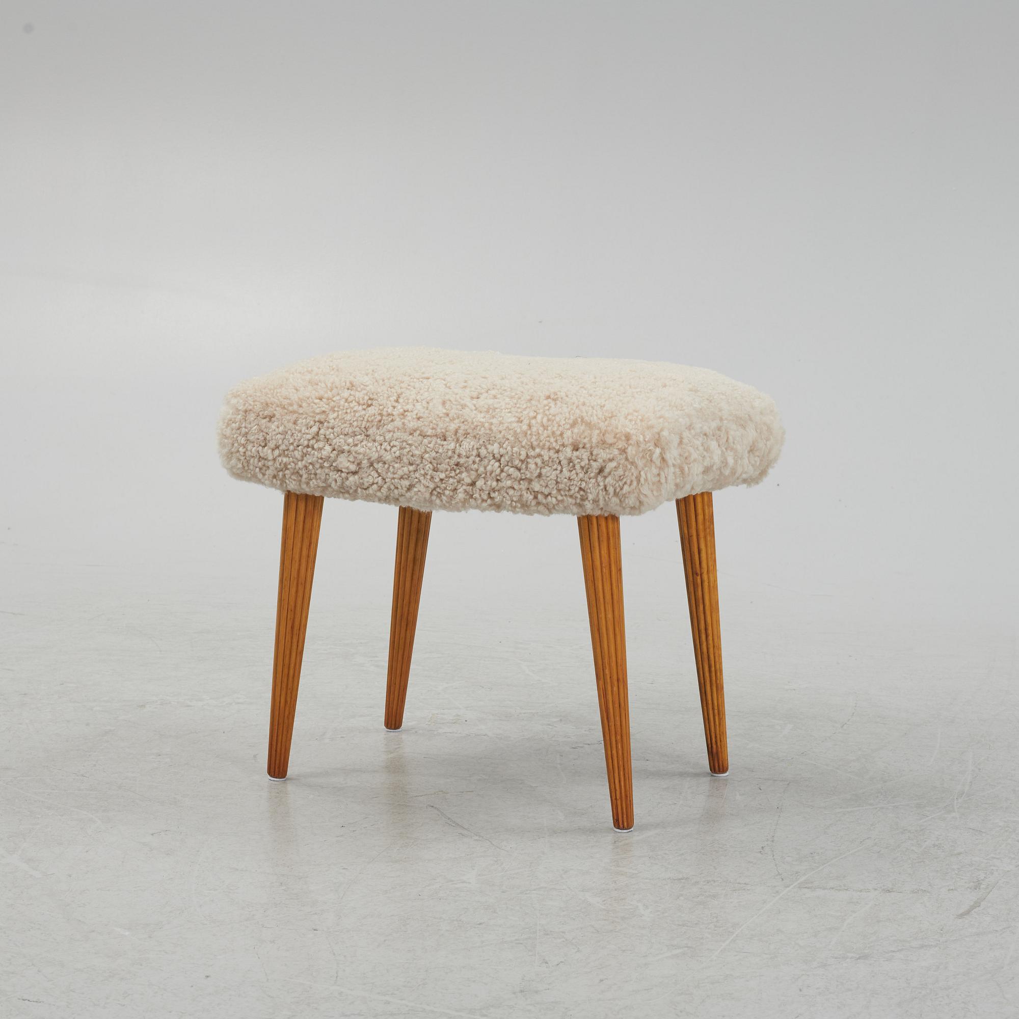A sheepskin upholstered stool, mid 20th Century.