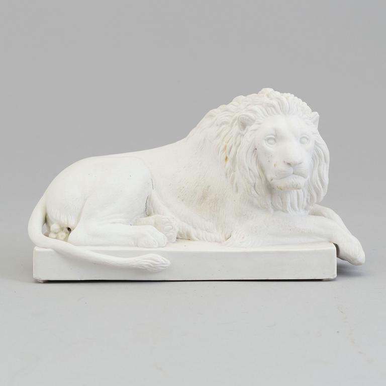 A bisquit figure of a 'reclining lion', Royal Copenhagen, Denmark, 19th Century.