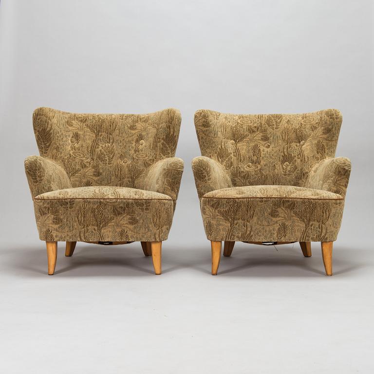 A pair of 1950s armchairs.