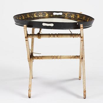 A tole-peinte Empire tray, first part 19th century on a later stand.