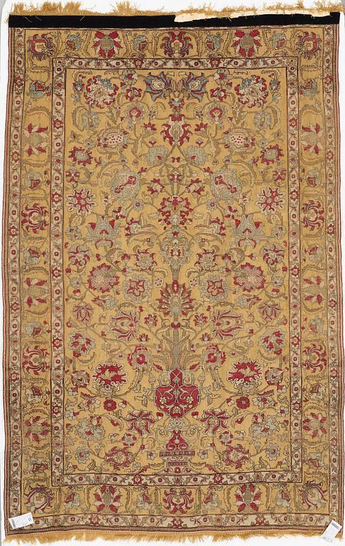 A rug, an antique silk metal brocaded Kashan, probably around 1910, ca 200-202,5 x 129-131 cm.