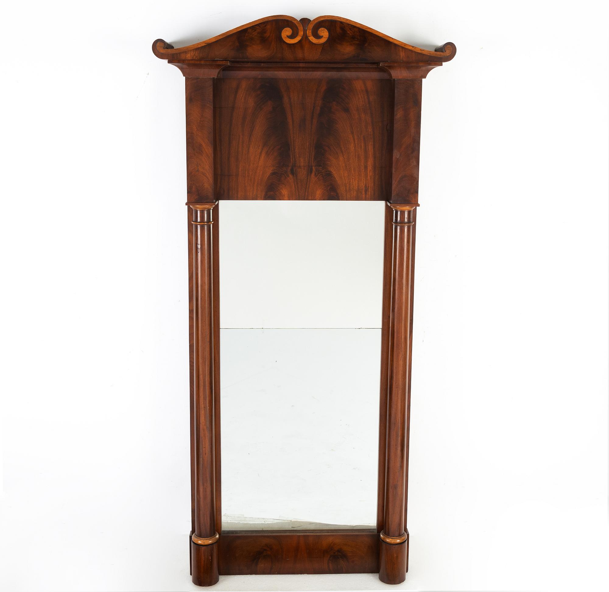 A 19th Century mahogany mirror with a console table.
