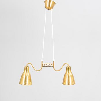 A mid 1900s brass ceiling pendant.