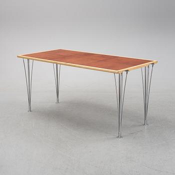 A birch and leather dining table produced by Mathsson International, 21th century.