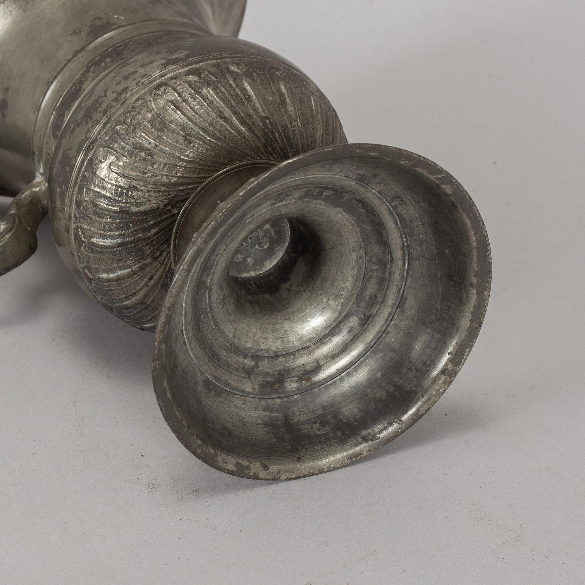 A pewter jug, probably 17th century.