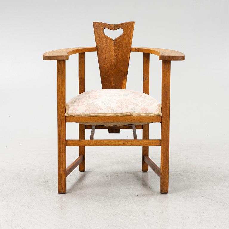 An oak Arts and Crafts armchair, early 20th century.