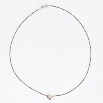 An 18K gold pendant, with a brilliant-cut diamond approximately 1.60 ct, chain in 14K white gold.