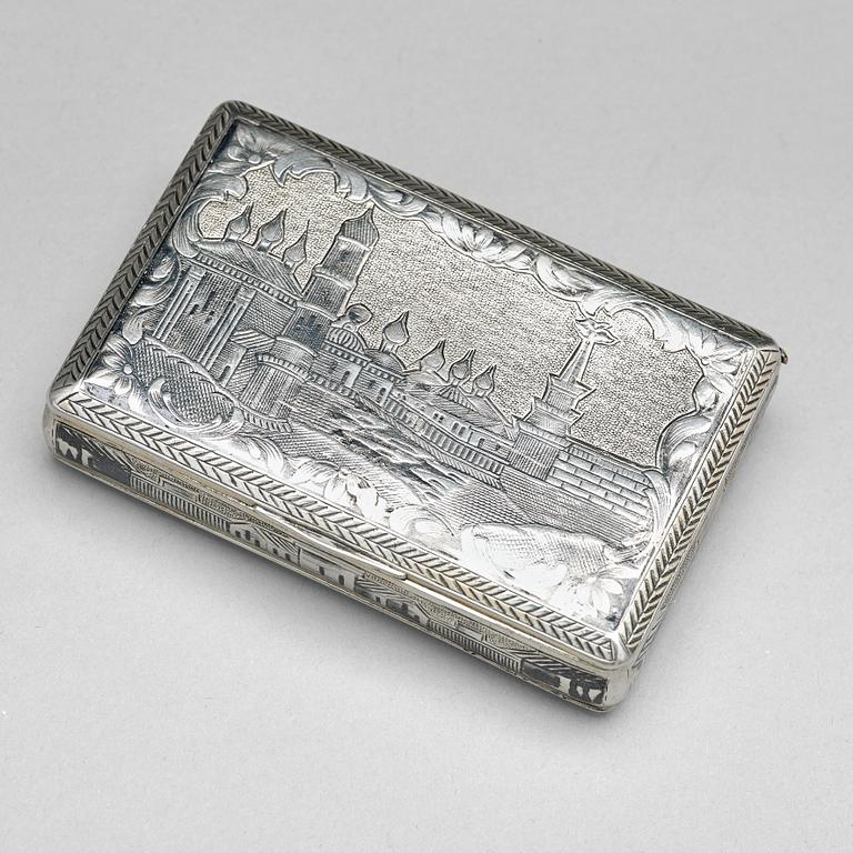 A Russian 19 th century parcel-gilt and niello cigarette-case, makers mark Ivan Kaltikov, Moscow.