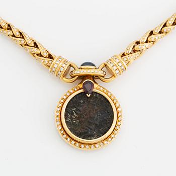 An 18K gold and ancient coin necklace set with a sapphire, a ruby and round brilliant-cut diamonds.