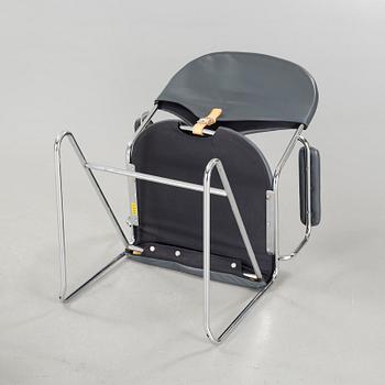 A pair of chairs by Sam Larsson for Dux, designed in 1974.