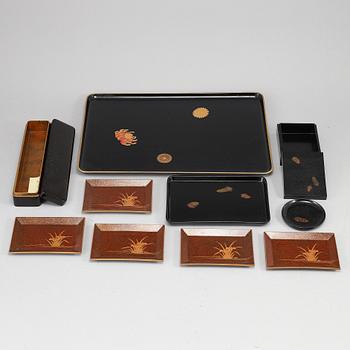 A group of Japanese lacquer trays and boxes, early 20th Century. (10 pieces).