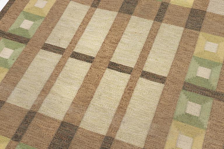 A flat weave carpet, signed, ca. 243 x 165 cm.