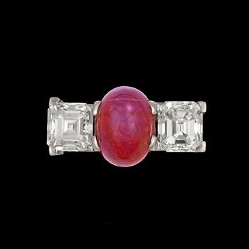 1065. A cabochon-cut ruby and Assher-cut diamond ring, each circa 1.00 ct.