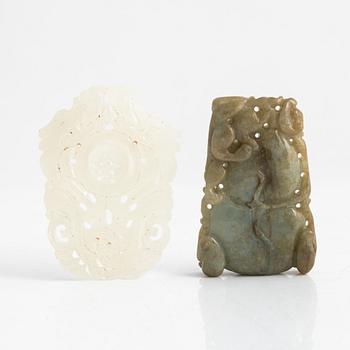 Two carved pendant, white jadeit and green stoen, China, 20th century.