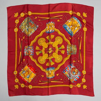 Hermès, a 'Les Tambours' silk scarf.