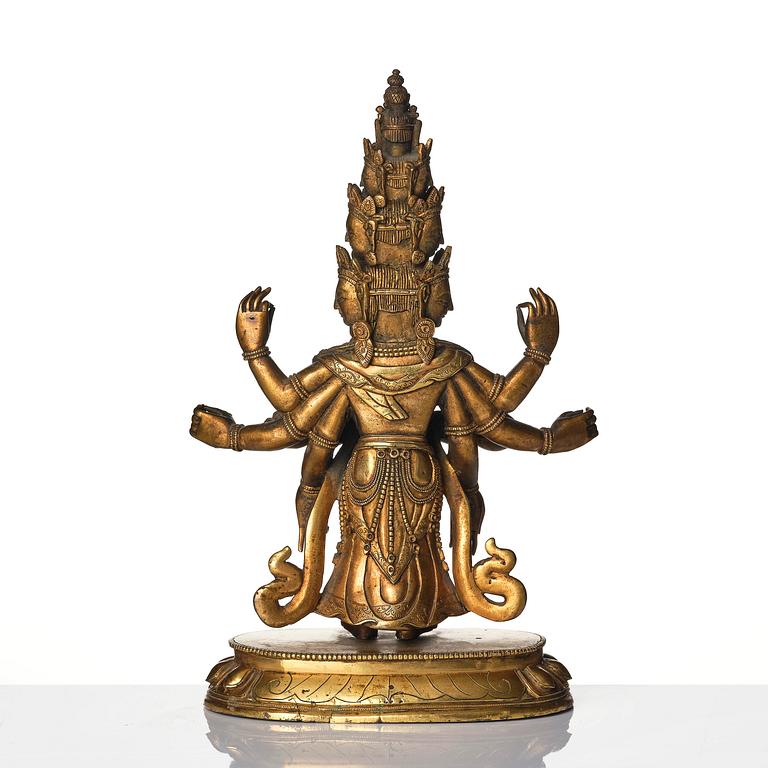 A Tibeto-Chinese gilt bronze figure of Avalokiteshvara Ekasdashamukra, 19th century.