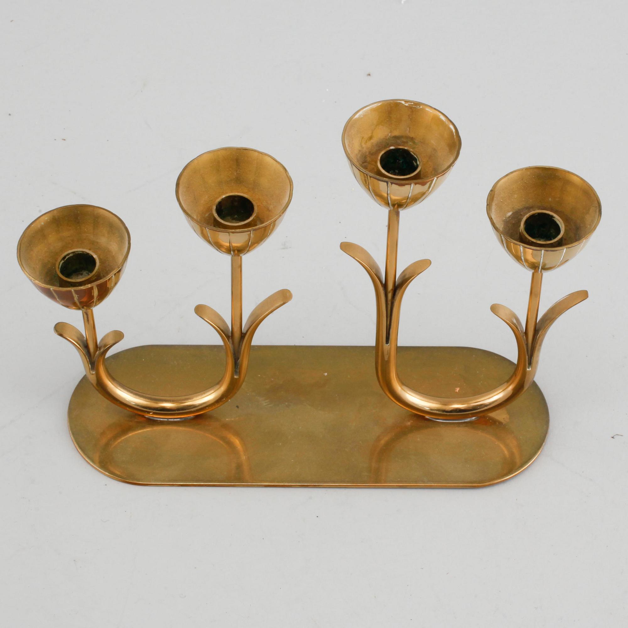 A candelabrum and one camdelstick by Gunnar Ander for Ystad Metall, 20th century.