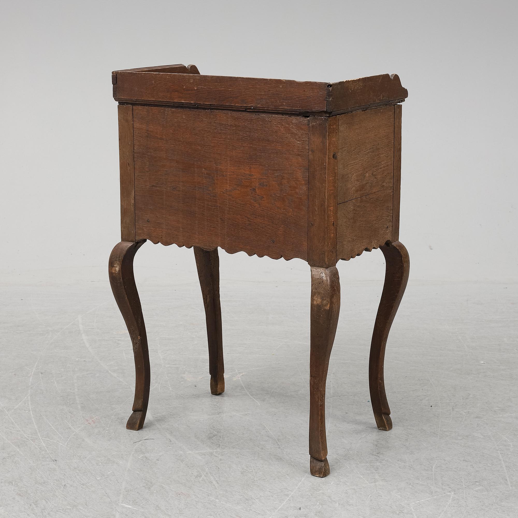 A mid 18th Century oak rococo bedside table.