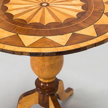 A tilt top table from 19th Century.