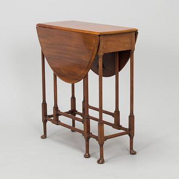 A 20th-century twin-gateleg table, England.