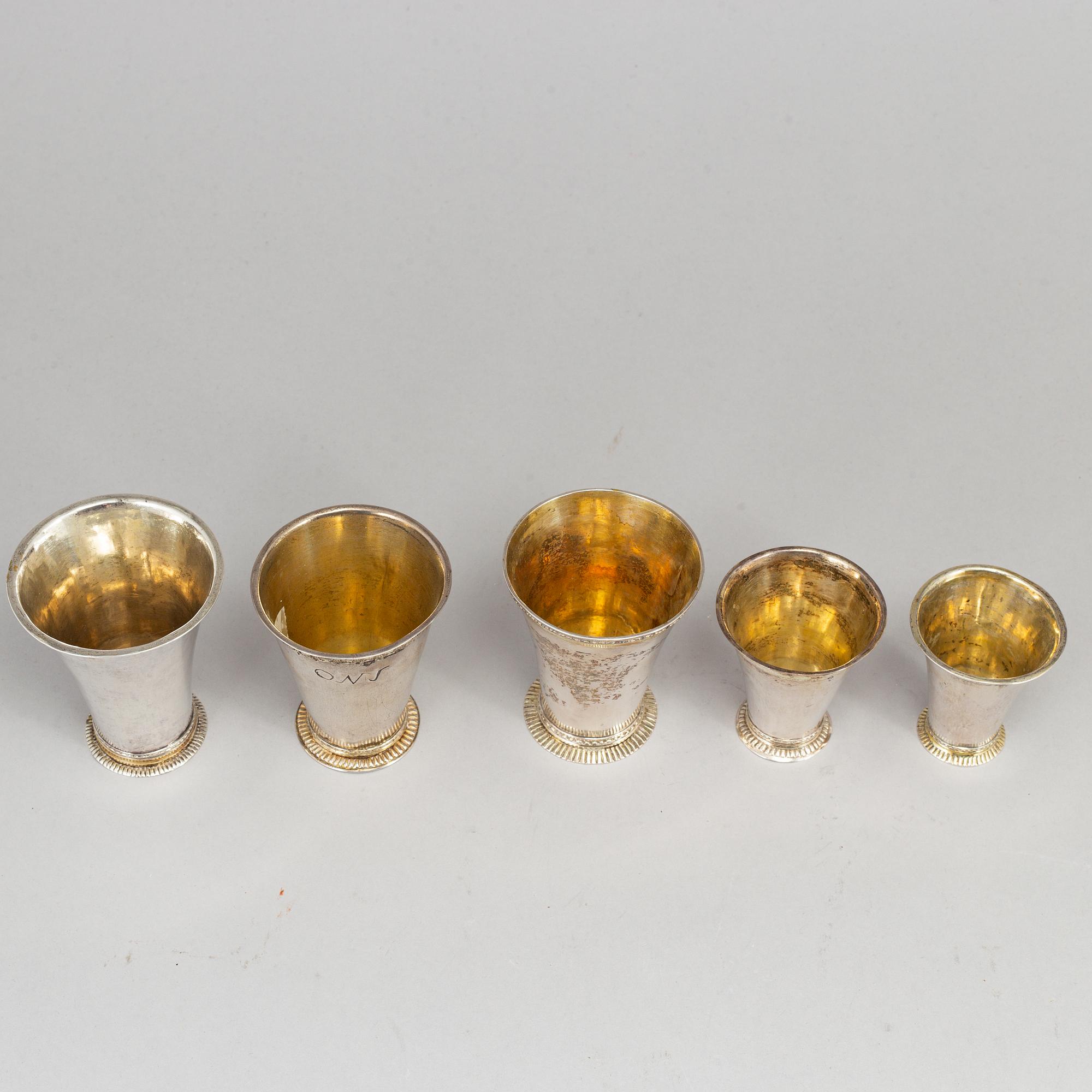 Five Swedish 18th century parcel-gilt silver beakers.