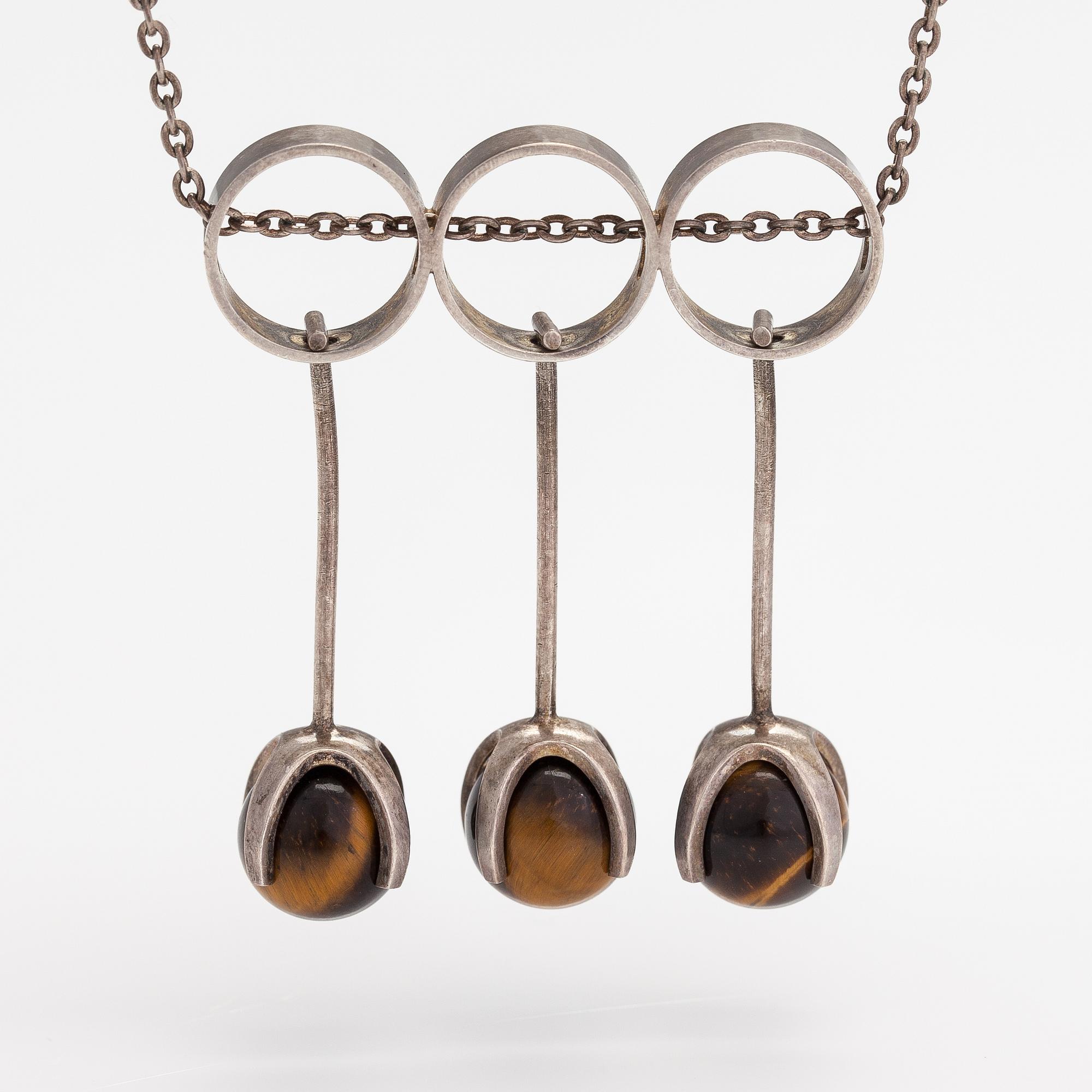 Elis Kauppi, A silver necklace with tiger's eye pearls. Kupittaan kulta, Turku 1965.