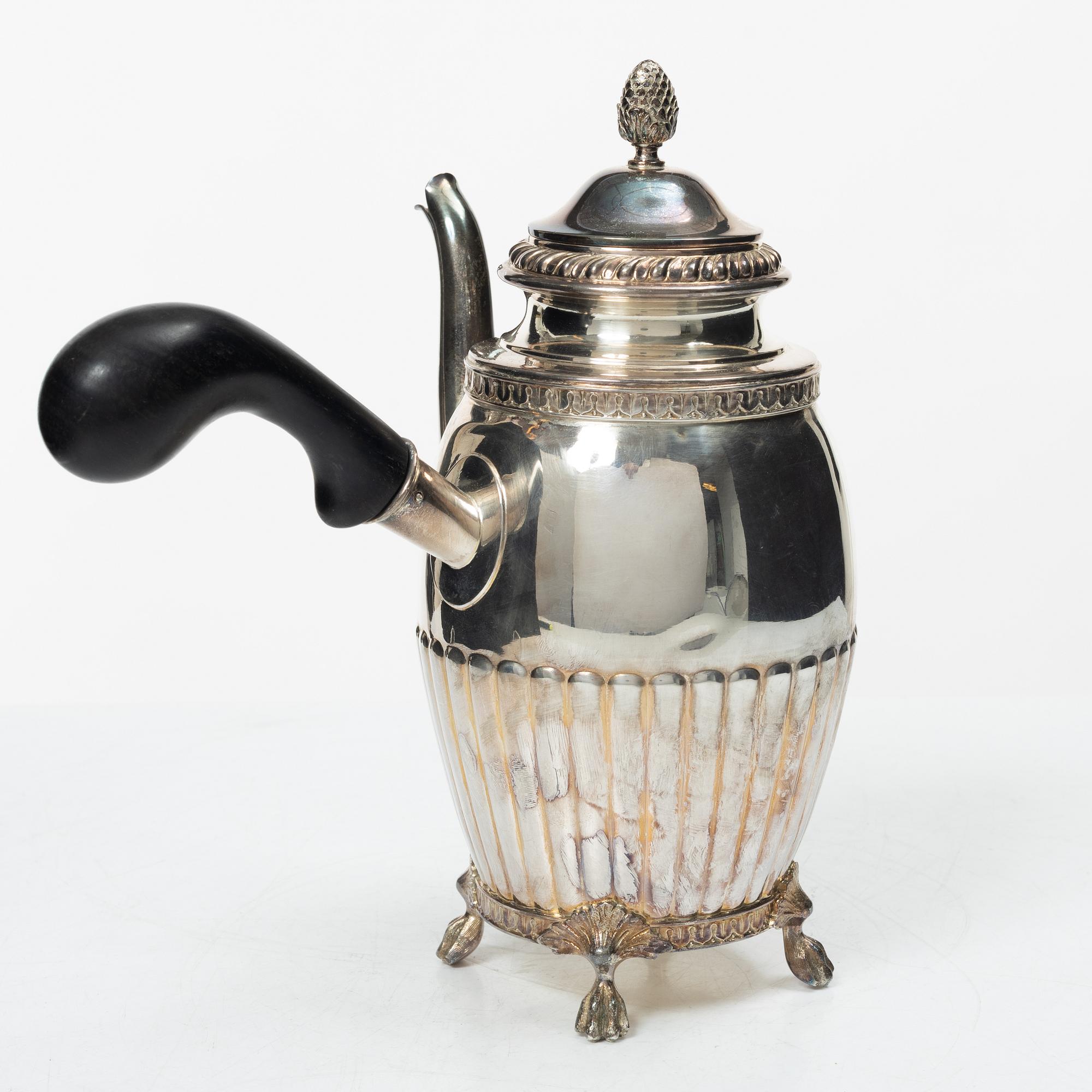 A Swedish silver coffee pot, cream jug and sugar box, Gustavian style, mark of AG Dufva, Stockholm 1911-1912.