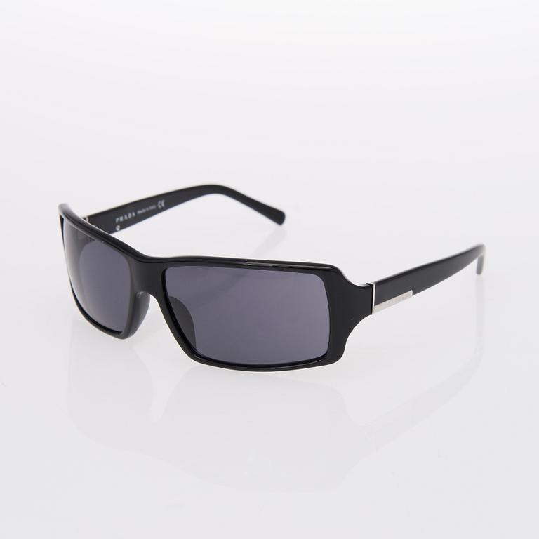 Two Pairs of Sunglasses, Prada and Chanel.