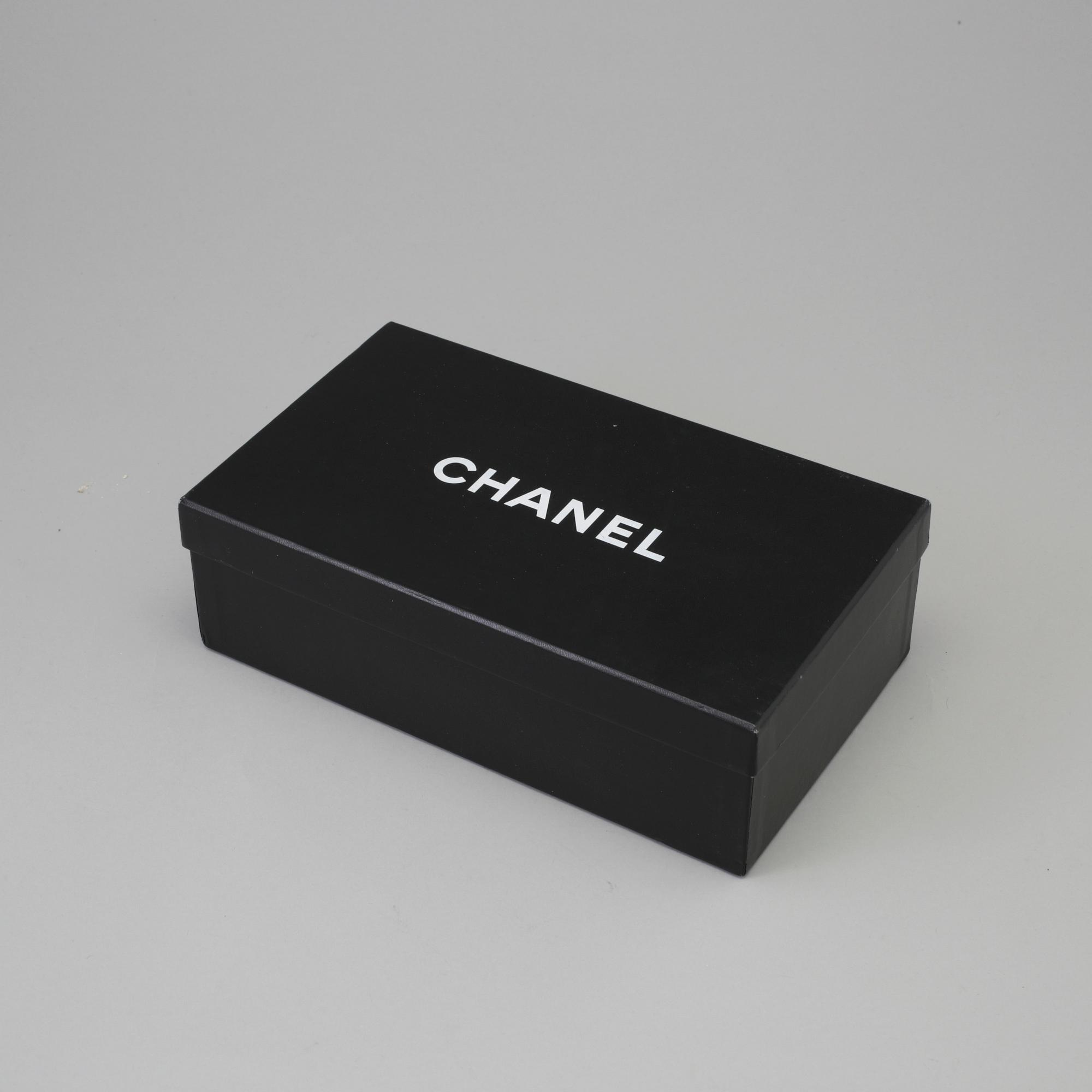 CHANEL, a pair of black plastic sandals. Size 38.